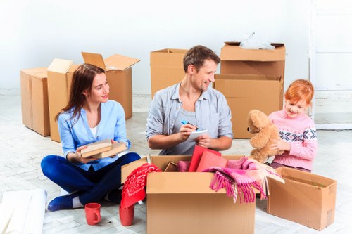 Person organizing boxes in Neweltham storage space