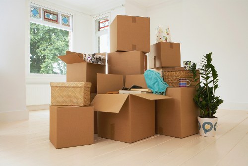 People moving boxes into a Neweltham storage unit